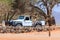 Camping worker in a white Land Rover. Sesriem Campsite, Sossusvlei, Namibia