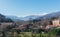 Camprodon village with some houses and Spanish Pyrenees at the bottom.