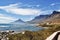 Camps Bay and Twelve Apostles against blue ocean and sky