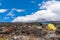 Campsite on mount Kilimanjaro under blue sky and white clouds