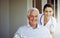 He can always count on quality healthcare. Portrait of a smiling caregiver and a senior man in a wheelchair outside.