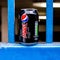 Can Of Pepsi Max Between Blue Railings Discarded As Rubbish With No People