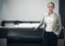 We can print anything. Portrait of a confidnet young publisher standing alongside a printing machine.