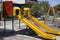 We can Slide and Swing red and yellow colour for two to play. It is in a childrens park located in a quiet neighbourhood with cars