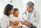 Can you hear what your pulse is saying. a mature doctor checking a little boys pulse during a checkup at home.