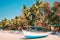 Canacona, Goa, India. Sightseeing Tourist Boat Parked On Famous Palolem Beach In Summer Sunny Day