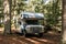 Canada Algonquin National Park 30.09.2017 Woman in front of Parked RV camper Lake two rivers Campground Cruise America