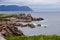 Canada beach view with rocks and grass ocean and sky background