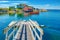 CANADA. Colorful wooden houses contrast with the Atlantic ocean in Blue Rock