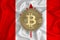 Canada flag, bitcoin gold coin on flag background. The concept of blockchain, bitcoin, currency decentralization in the country.