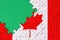 Canada flag is depicted on a completed jigsaw puzzle with free green copy space on the left side
