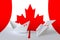 Canada flag depicted on paper origami airplane and boat. Handmade arts concept