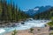 Canada forest landscape with big mountain in the background and the river flowing at Mistaya Canyon, Alberta