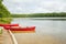 Canada forest park nature with red kayaks canoe boats by water
