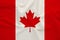 Canada national flag on gentle silk with wind folds, travel concept, immigration, politics