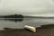 Canada Ontario Lake two rivers grey morning dark atmosphere Canoe Canoes parked beach water in Algonquin National Park