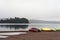 Canada Ontario Lake two rivers grey morning dark atmosphere Canoe Canoes parked beach water in Algonquin National Park