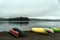 Canada Ontario Lake two rivers grey morning dark atmosphere Canoe Canoes parked beach water in Algonquin National Park