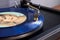 CANADA, Ontario - Nov 09, 2019: Turntable Tonearm with Headshell on the Blue Vinyl