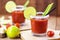 Canadian Caesar drink. Made with vodka, hot sauce and Worcestershire sauce, served with ice in a celery glass with a salted rim,