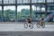 Canadian couple riding their bikes in old port, Montreal, Quebec, Canada