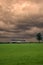 Canadian farm under stormy and threatening skies