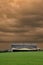 Canadian farm under stormy and threatening skies