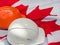 Canadian flag and two protective hardhats. Close-up