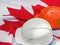 Canadian flag and two protective hardhats. Close-up