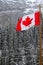 Canadian Flag waving over Banff National Park, Canada