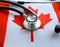 Canadian healthcare. Medical stethoscope on a Canadian flag. Canadian health insurance concept