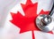 Canadian healthcare. Medical stethoscope on a Canadian flag. Canadian health insurance concept