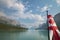 Canadian landscape with mountains, Maligne lake and flag. Albert