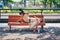 Canadian man sleeping on the bench on a hot summer day in Montreal, Quebec, Canada