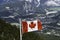 Canadian Maple Leafe Flag flying over mountains