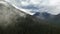 Canadian Mountain Landscape Covered in Clouds. Aerial Nature Background.