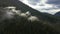 Canadian Mountain Landscape Covered in Clouds. Aerial Nature Background.