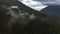 Canadian Mountain Landscape Covered in Clouds. Aerial Nature Background.