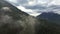 Canadian Mountain Landscape Covered in Clouds. Aerial Nature Background.