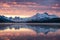 Canadian rockies with foggy reflection on Maligne lake and colorful sky in morning at Jasper national park