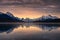 Canadian rockies with foggy reflection on Maligne lake and colorful sky in morning at Jasper national park