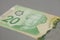 Canadian twenty dollars on gray background