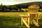 Canadian yellow adirondack chair in garden