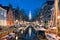 The canal in Amsterdam with Zuiderkerk church in Amsterdam city, Netherlands