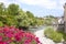 Canal behind some petunias in Oloron Saint Marie