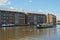 A canal boat passes through Gloucester Docks heading towards the Gloucester & Sharpness Canal,  Gloucester, UK