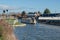 Canal boat passing a swing bridge in Gloucestershire UK