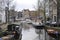 Canal boats in autumn in Amsterdam, Holland