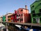 Canal with boats and homes of many colors in Burano in Venice in Italy