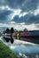 Canal boats under moody sky